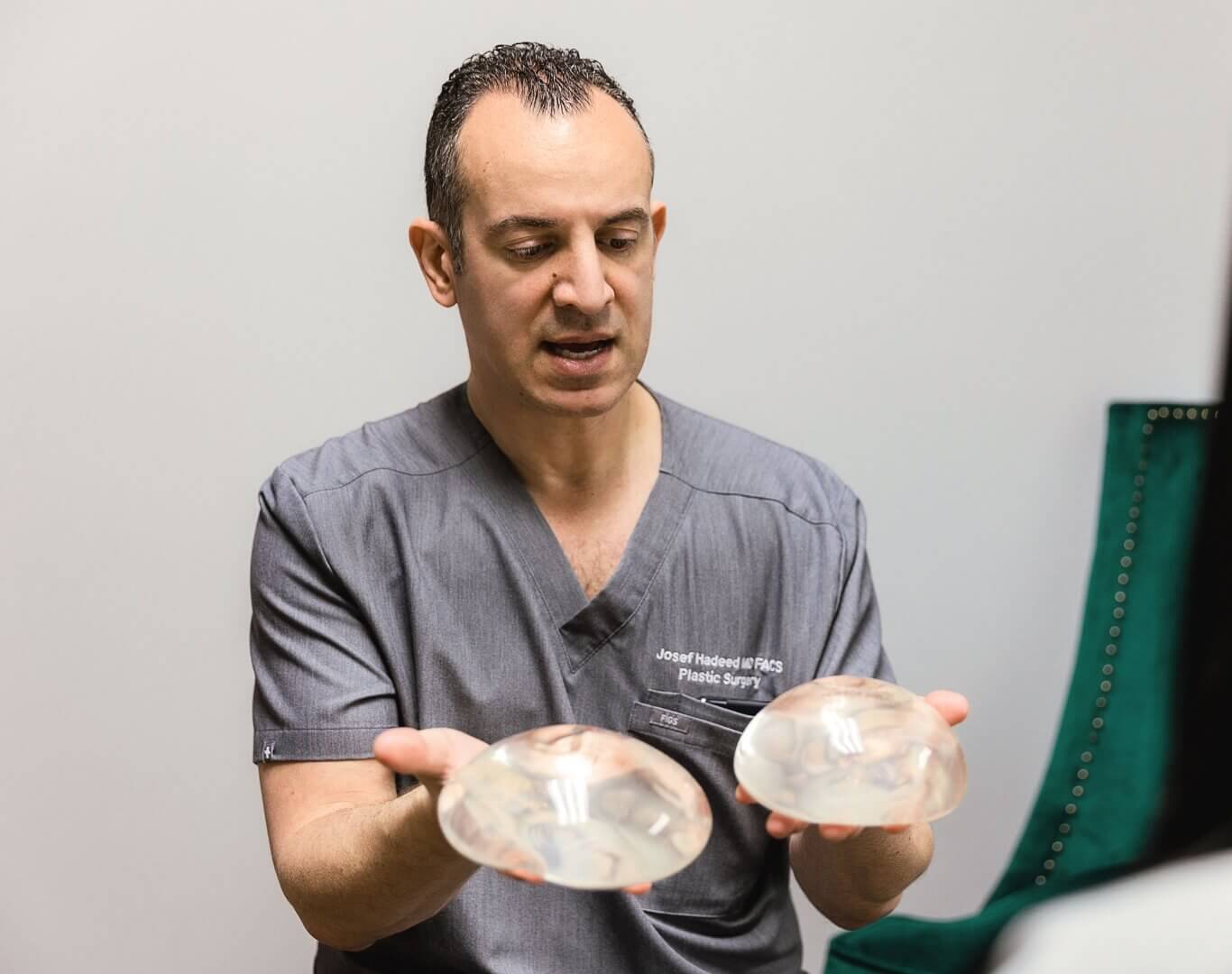 Dr. Hadeed in consultation discussing the difference between implant types and sizes